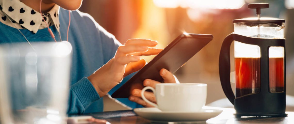 customer listening to tablet with tea