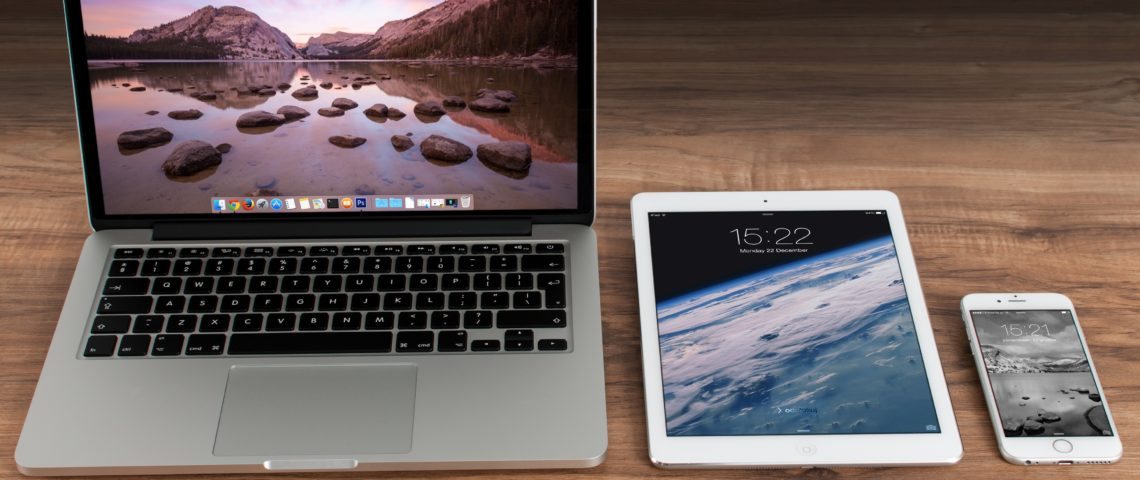 apple iphone and macbook on desk
