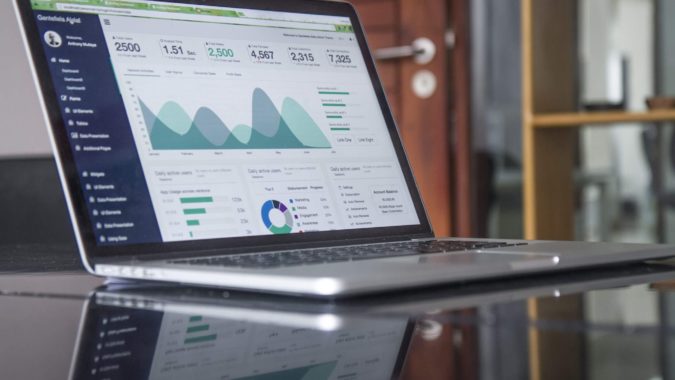 Laptop showing web based CRM reporting screen