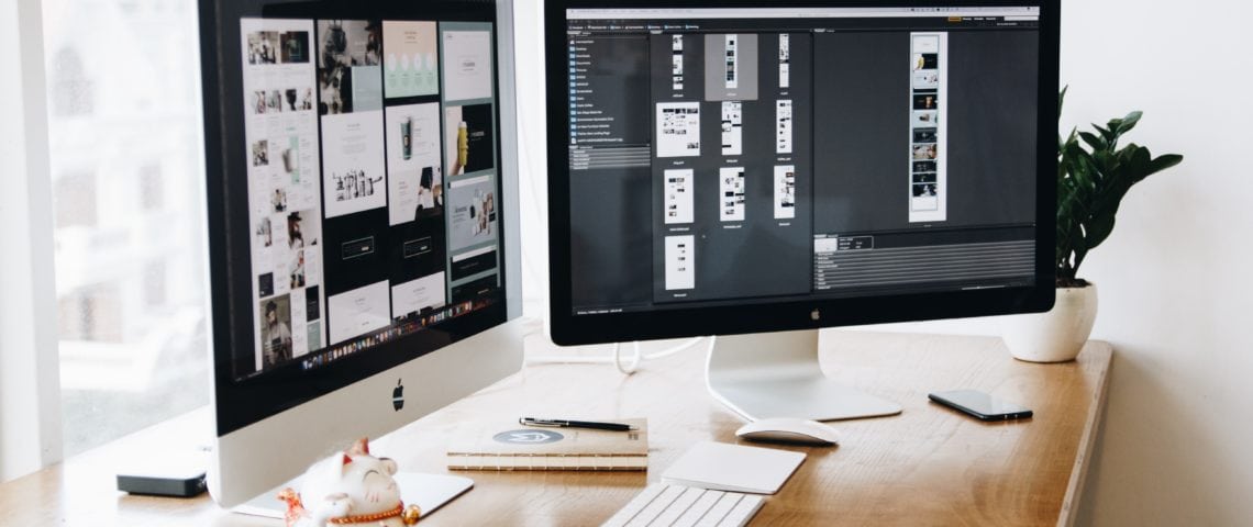 computer displaying designs for website