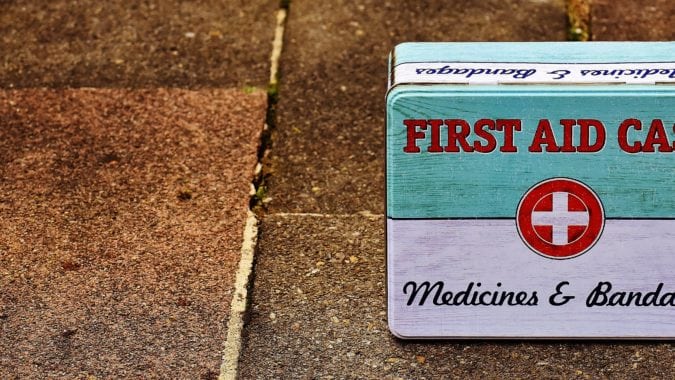 Emergency first aid kit on the ground
